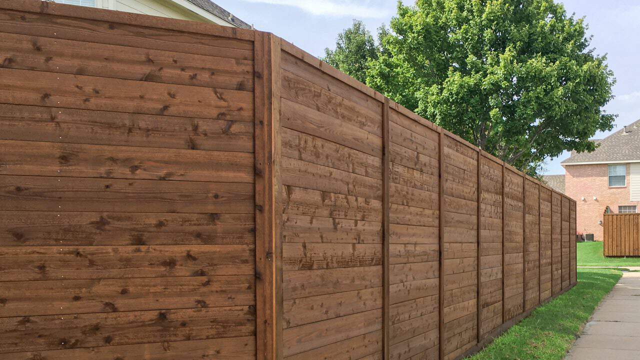 fence company Alvin dark stained wood fence