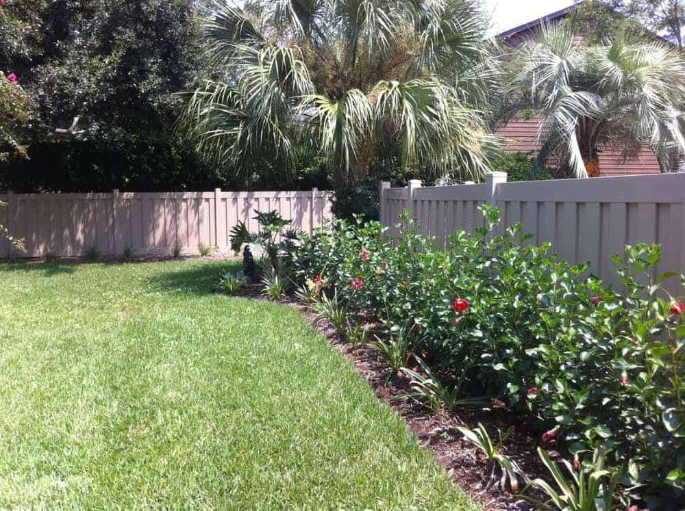 Trex Fence near yard and palm trees